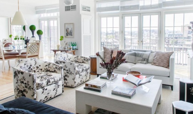 living room with fireplace and French doors with access to large balcony