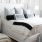 spacious, carpeted bedroom with large windows