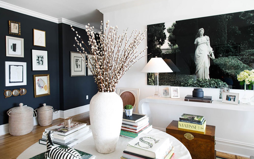 gallery wall and books on living room table