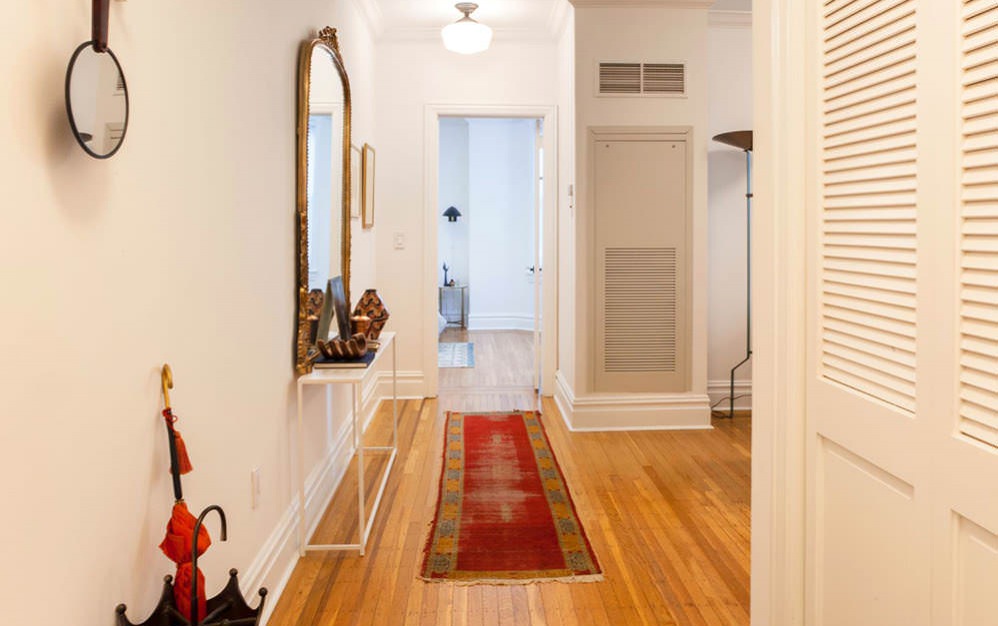 lighted entry hall with closet