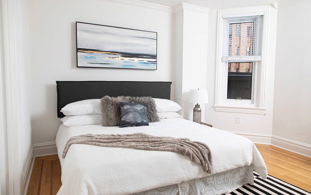 bedroom with wood flooring