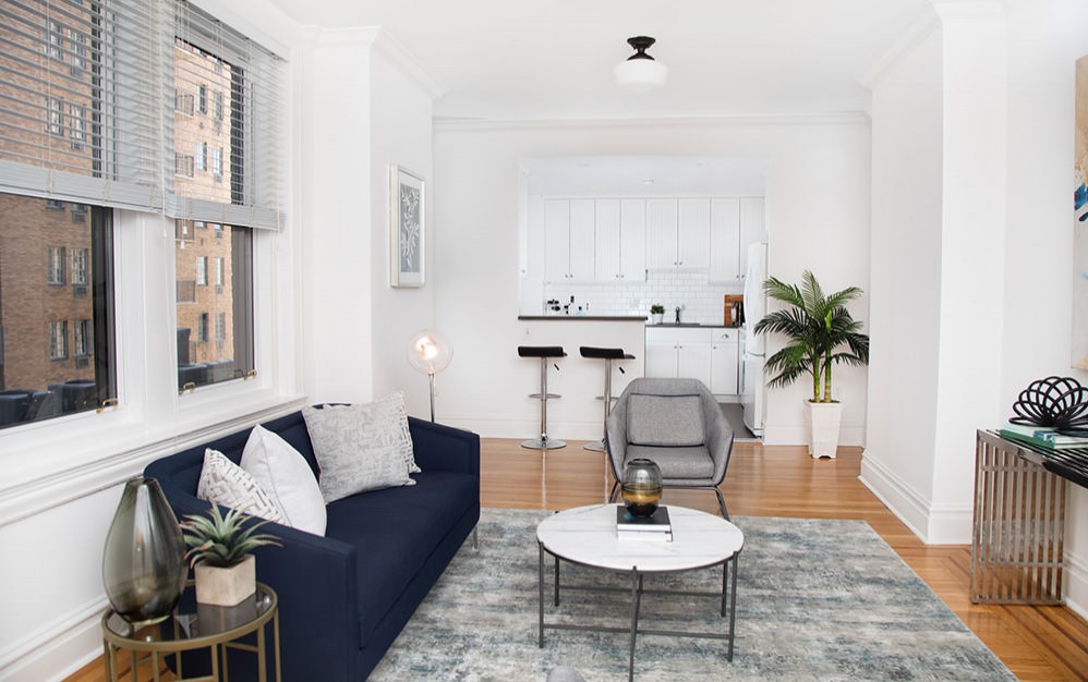 well lit living space and kitchen