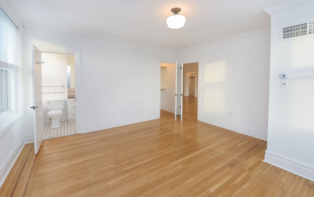unfurnished bedroom with wood floors