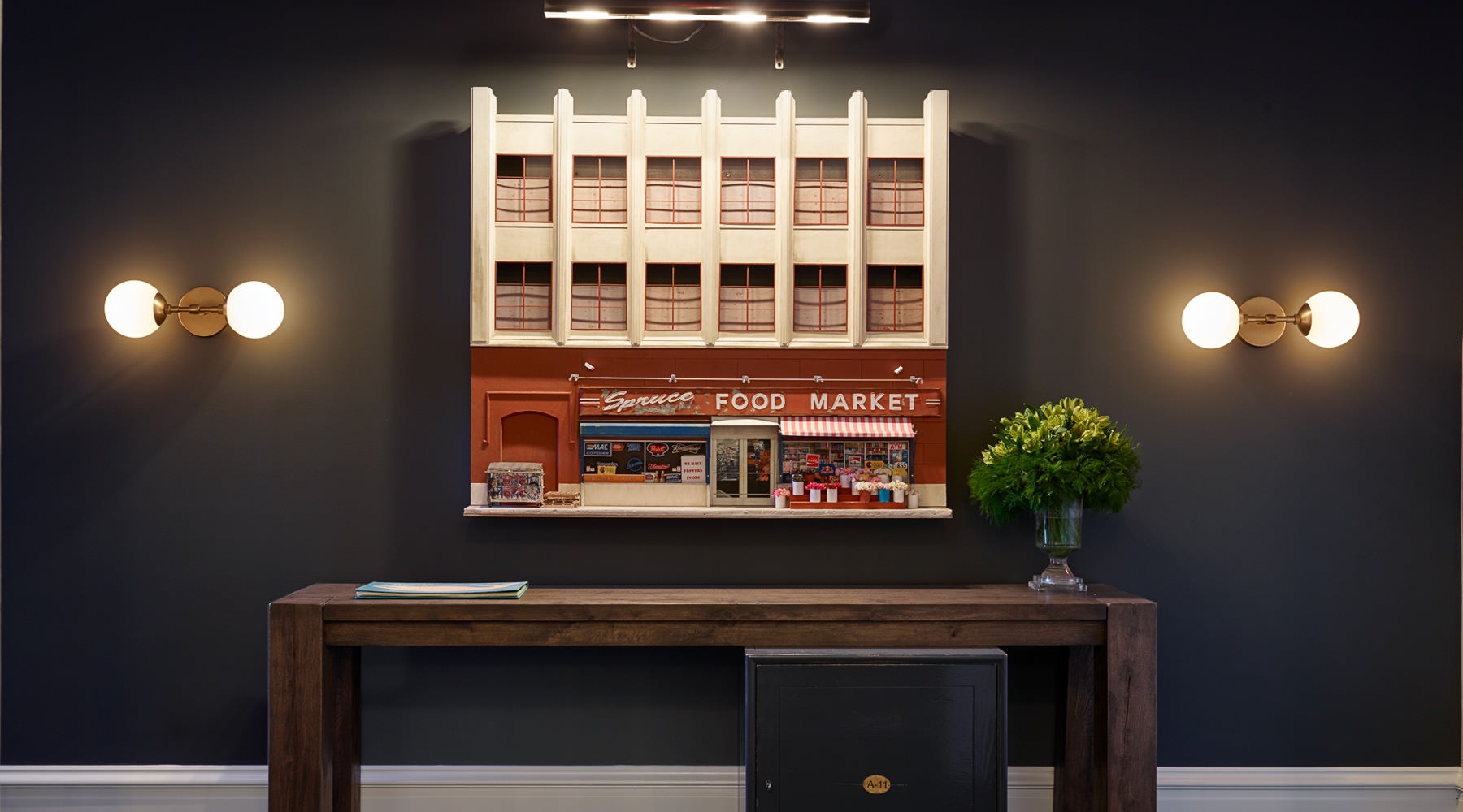 entrance hall with wall sconces at The Touraine