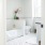 large, sun-filled bathroom with tub