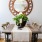 large window brightens dining room with table and chairs