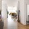 a long, wide hallway with white walls